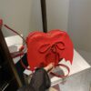 02a7ffa2-ddf5-49fc-9b0e-c6619715a605.jpg Heart Shape Bag Strap Design Bat Wings One Shoulder Crossbody Bag