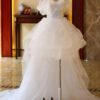 1618912027400.jpg The Bride'S Wedding Dress With Long Tail In Front Of The Studio