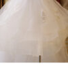 1618912027420.jpg The Bride'S Wedding Dress With Long Tail In Front Of The Studio