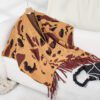 47fc9bf7-3f3c-4bd9-b2c6-697b899d820c.jpg Drizzle-Color Leopard-Print Knitted Tassel CapeShoulder Wrap For Women