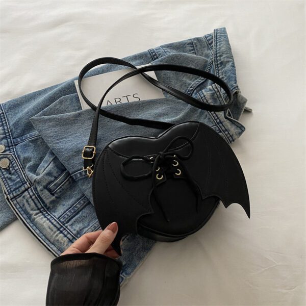 9f461fc4-8cff-4a39-88d1-8b1fc990d983.jpg Heart Shape Bag Strap Design Bat Wings One Shoulder Crossbody Bag