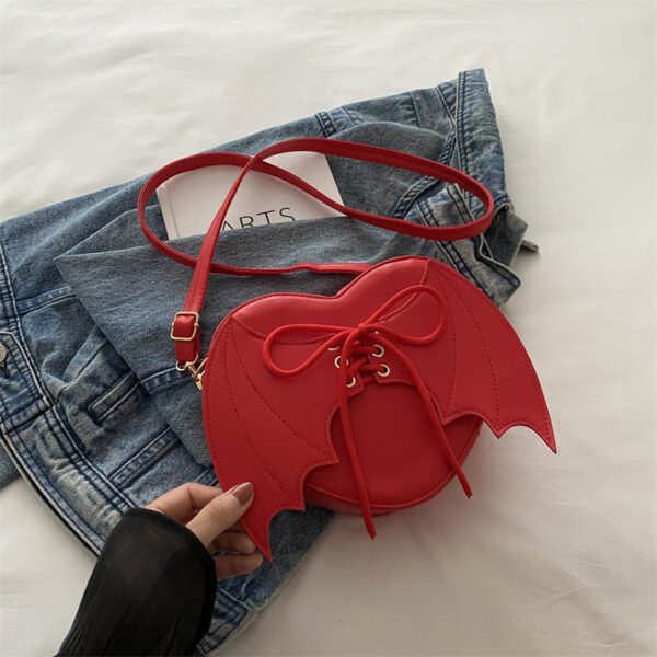 c09597aa-868a-4f62-9715-6b767a0afe17.jpg Heart Shape Bag Strap Design Bat Wings One Shoulder Crossbody Bag