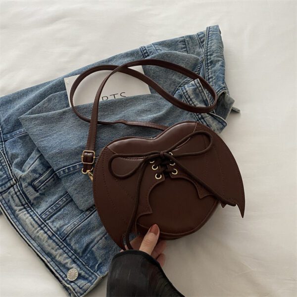 f304f968-4d11-4d61-a386-5029effb24f8.jpg Heart Shape Bag Strap Design Bat Wings One Shoulder Crossbody Bag